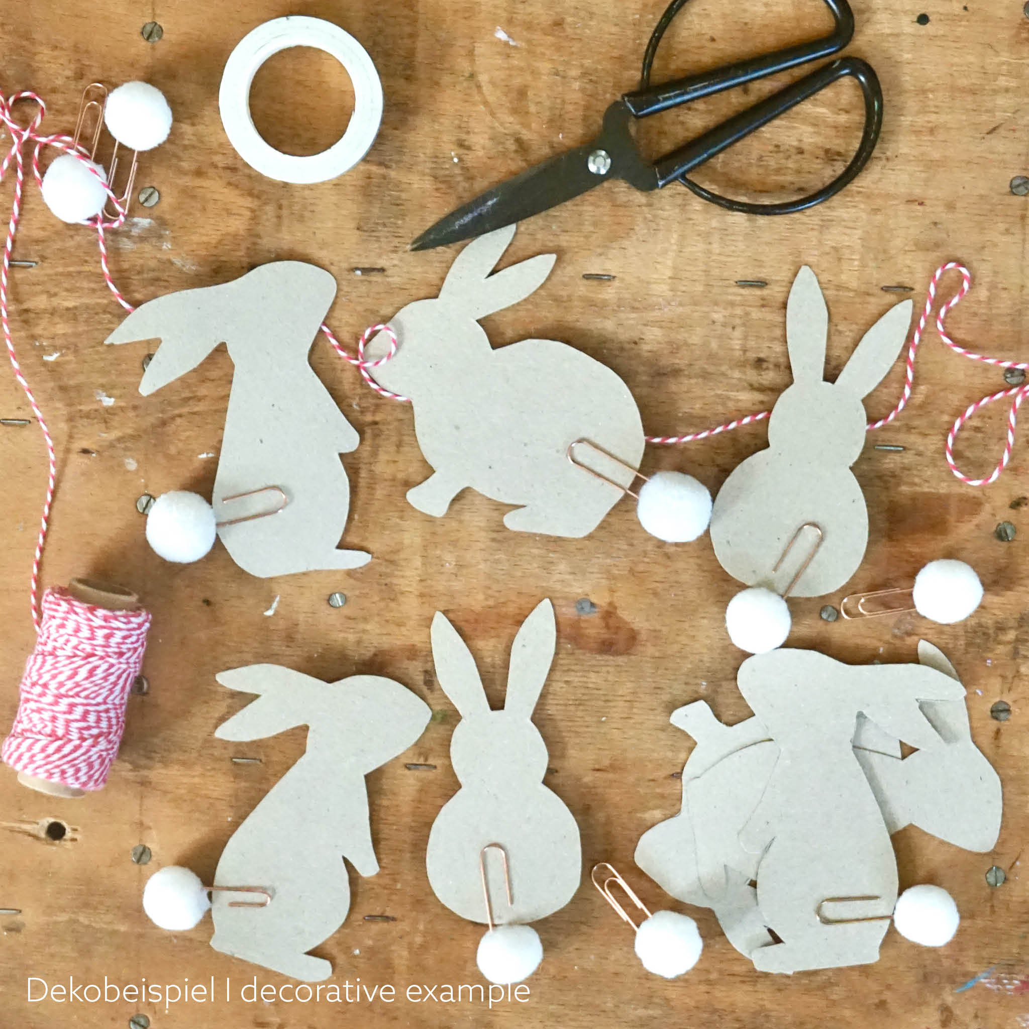 Papier-Hasen mit Ponpom-Schwänzchen - Beispiel als Girlande